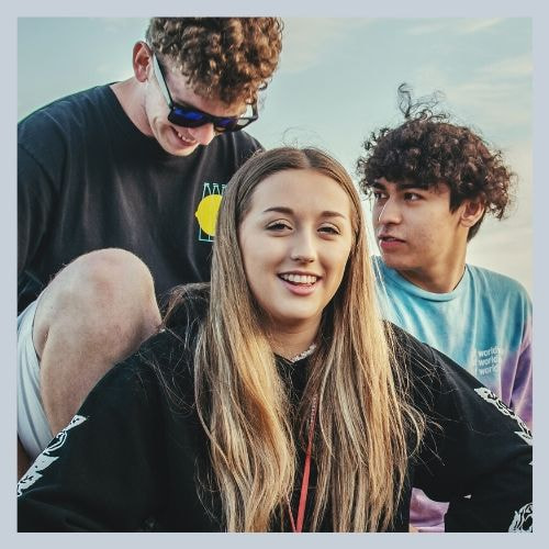 Youth Ministry. 3 Teenagers smiling.